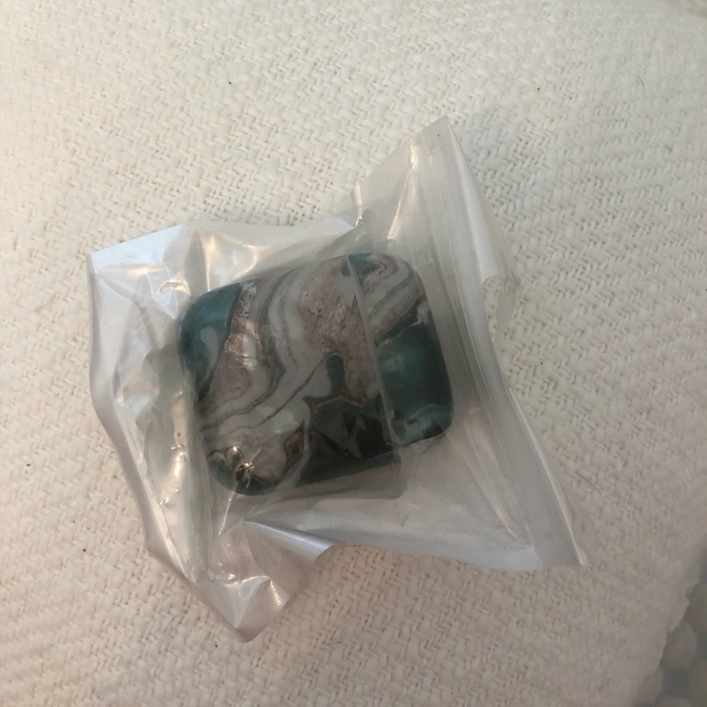 Marble green original AirPod case in packaging